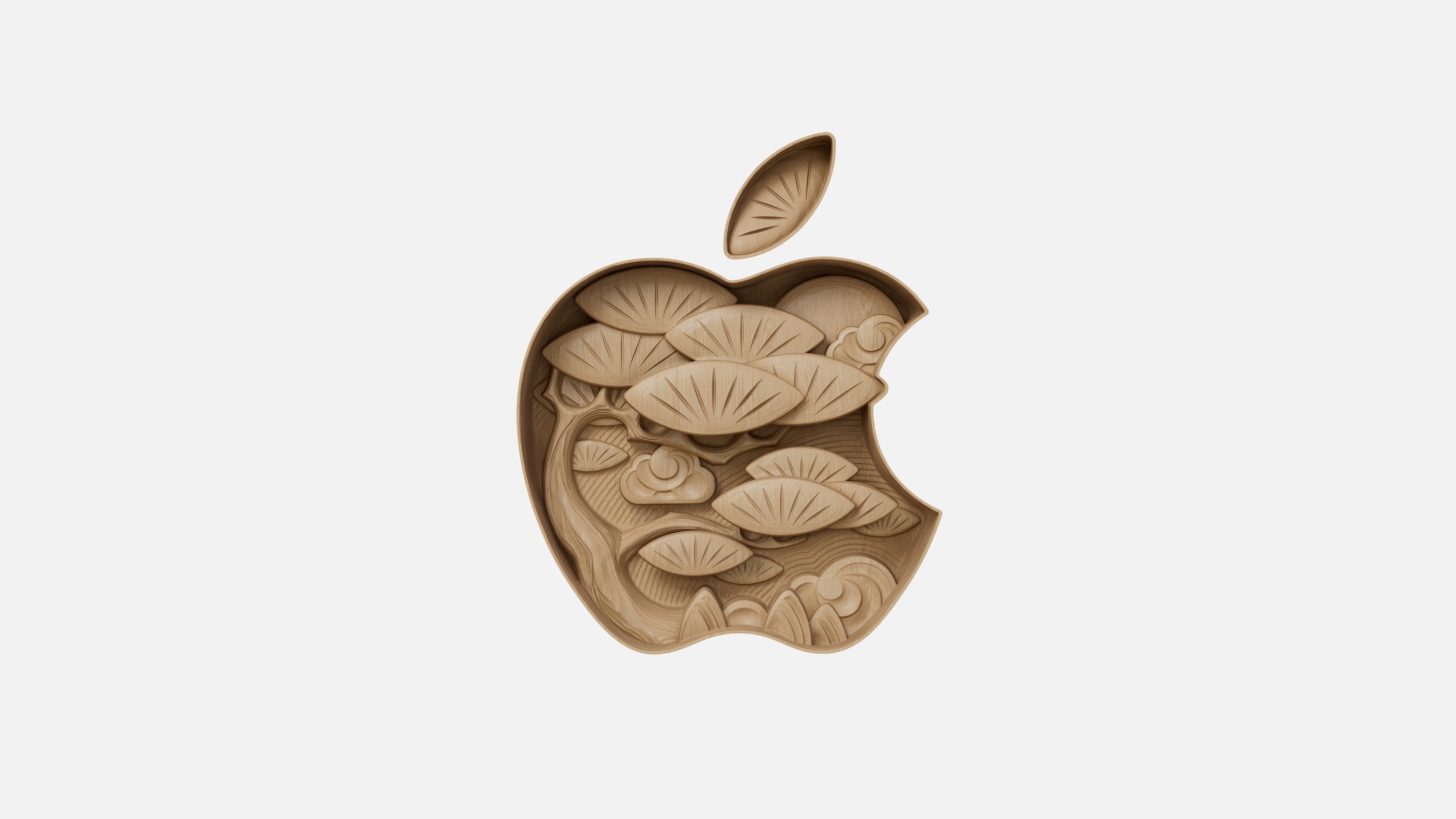 The Apple logo, but as if it’s centre is carved out of wood. The carving is of a tree.